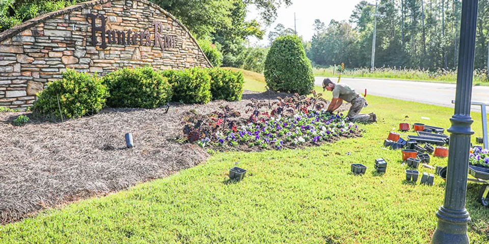 Sparta Lawn Care planting work in a landscape bed