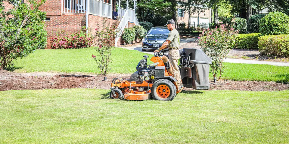 Crew servicing a residential lawn
